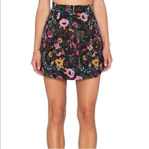 Lucca pleated black flowered mini skirt size large